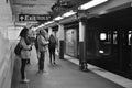 New Yorkers on Subway Platform Commuters Traveling MTA Train Arriving Royalty Free Stock Photo