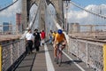 New Yorkers walk on the Brooklyn Bridge