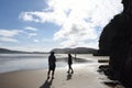 New Zealand- Cathedral Caves Beach Tourists in Silhouette Royalty Free Stock Photo