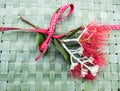 New Zealand Christmas Tree or Pohutukawa flower on woven green f Royalty Free Stock Photo