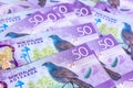 New Zealand currency $50, New Zealand Dollar banknotes show kokako blue wattled crow