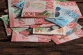 New Zealand dollars spread out on the table