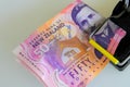 New Zealand fifty dollar notes caught in a mouse trap. Royalty Free Stock Photo
