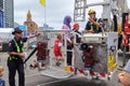 New Zealand firemen demonstrating their equipment to a family