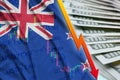 New Zealand flag and chart falling US dollar position with a fan of dollar bills Royalty Free Stock Photo