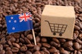 New Zealand flag with shopping cart on coffee bean, import export trade online commerce concept Royalty Free Stock Photo