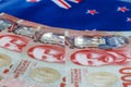 New Zealand money on the background of the colors of the national flag, One hundred dollar banknotes, Economic and business Royalty Free Stock Photo