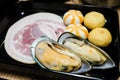 New zealand mussel, meat ball and kurobuta pork serve on plate.