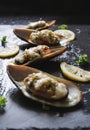 New Zealand Mussels baked with butter, garlic, parsley and cheese Royalty Free Stock Photo