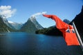 New Zealand Red Ensign maritime flag on a boat on Milford Sound Royalty Free Stock Photo