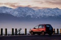 Red 1995 Mitsubishi RVR 4WD vehicle parks at the coast line of Kaikoura Royalty Free Stock Photo