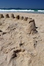 New Zealand: summer beach sand castles Royalty Free Stock Photo