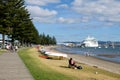 Leisure activity image of families and couples relaxing along the beach of tauranga