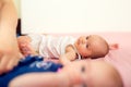 Newborn babies - twin sisters together with their mother. Royalty Free Stock Photo