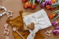 Newborn baby accessory and wooden toys in a box on a brown background Royalty Free Stock Photo