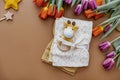 Newborn baby accessory and wooden toys in a box on a brown Royalty Free Stock Photo