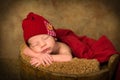 Newborn baby in antique bucket Royalty Free Stock Photo