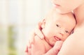 Newborn baby in the arms of mother