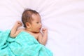 Newborn baby of asia relax in a good mood on white bed. Royalty Free Stock Photo