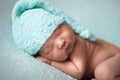 Newborn baby asian boy sleeping at blue background Royalty Free Stock Photo