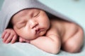 Newborn baby asian boy sleeping at blue background Royalty Free Stock Photo