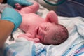 Newborn baby being examined