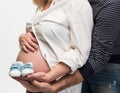 Newborn baby booties in parents hands Royalty Free Stock Photo