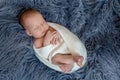 Newborn baby boy in bed. New born child sleeping under a white knitted blanket. Children sleep. Royalty Free Stock Photo