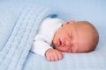 Newborn baby boy on a blue blanket Royalty Free Stock Photo