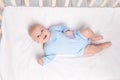 Newborn baby boy in the crib, the concept of children and birth Royalty Free Stock Photo