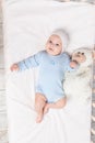 newborn baby boy in crib with teddy bear toy  children and birth concept Royalty Free Stock Photo