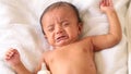 Newborn baby boy drinking milk from a bottle