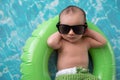 Newborn Baby Boy Floating on a Swim Ring Royalty Free Stock Photo