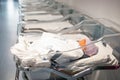 Newborn baby in first of many small hospital beds