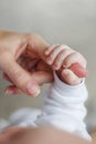 Newborn baby boy holding his mother`s finger Royalty Free Stock Photo