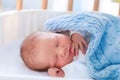 Newborn baby boy in hospital cot Royalty Free Stock Photo