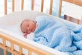 Newborn baby boy in hospital cot Royalty Free Stock Photo