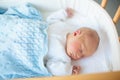 Newborn baby boy in hosptal cot