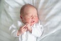 Newborn baby boy in hosptal cot