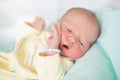 Newborn baby boy in hosptal cot