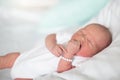 Newborn baby boy in hosptal cot