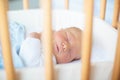 Newborn baby boy in hosptal cot