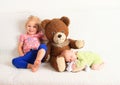 Newborn baby boy with little sister and Teddy bear Royalty Free Stock Photo