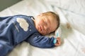 Newborn baby boy with hairbrush in his hand Royalty Free Stock Photo