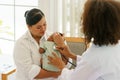 Newborn baby boy visiting the doctor for checkup health Royalty Free Stock Photo