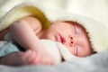 Newborn baby boy on white carpet closeup Royalty Free Stock Photo