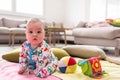 Newborn baby boy sitting on colorful blankets Royalty Free Stock Photo