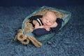 Newborn Baby Boy Sleeping in a Boat Royalty Free Stock Photo