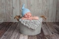 Newborn Baby Boy Sleeping in a Bucket Royalty Free Stock Photo