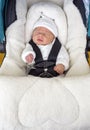 Newborn baby boy sleeping in comfortable car seat